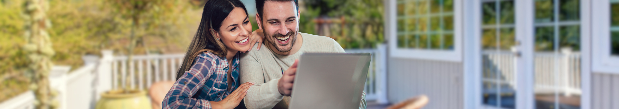 Happy couple on laptop