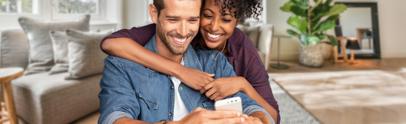 Happy couple on cellphone